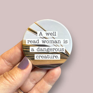 A well read woman is a dangerous creature round magnet