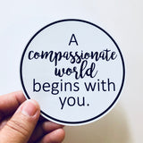 A compassionate world begins with you sticker