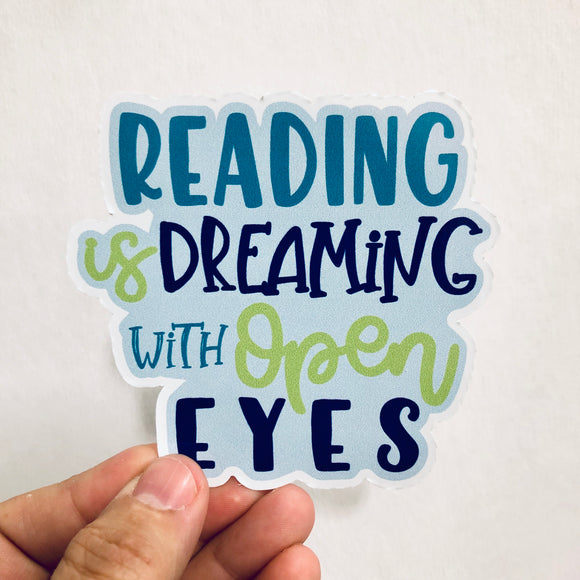reading is dreaming with open eyes sticker